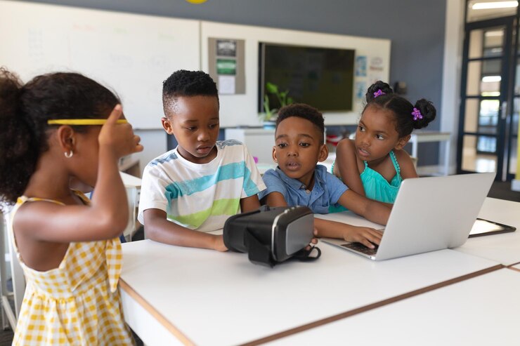 african-american-elementary-school-students-using-vr-glasses-laptop-desk-classroom_13339-304147